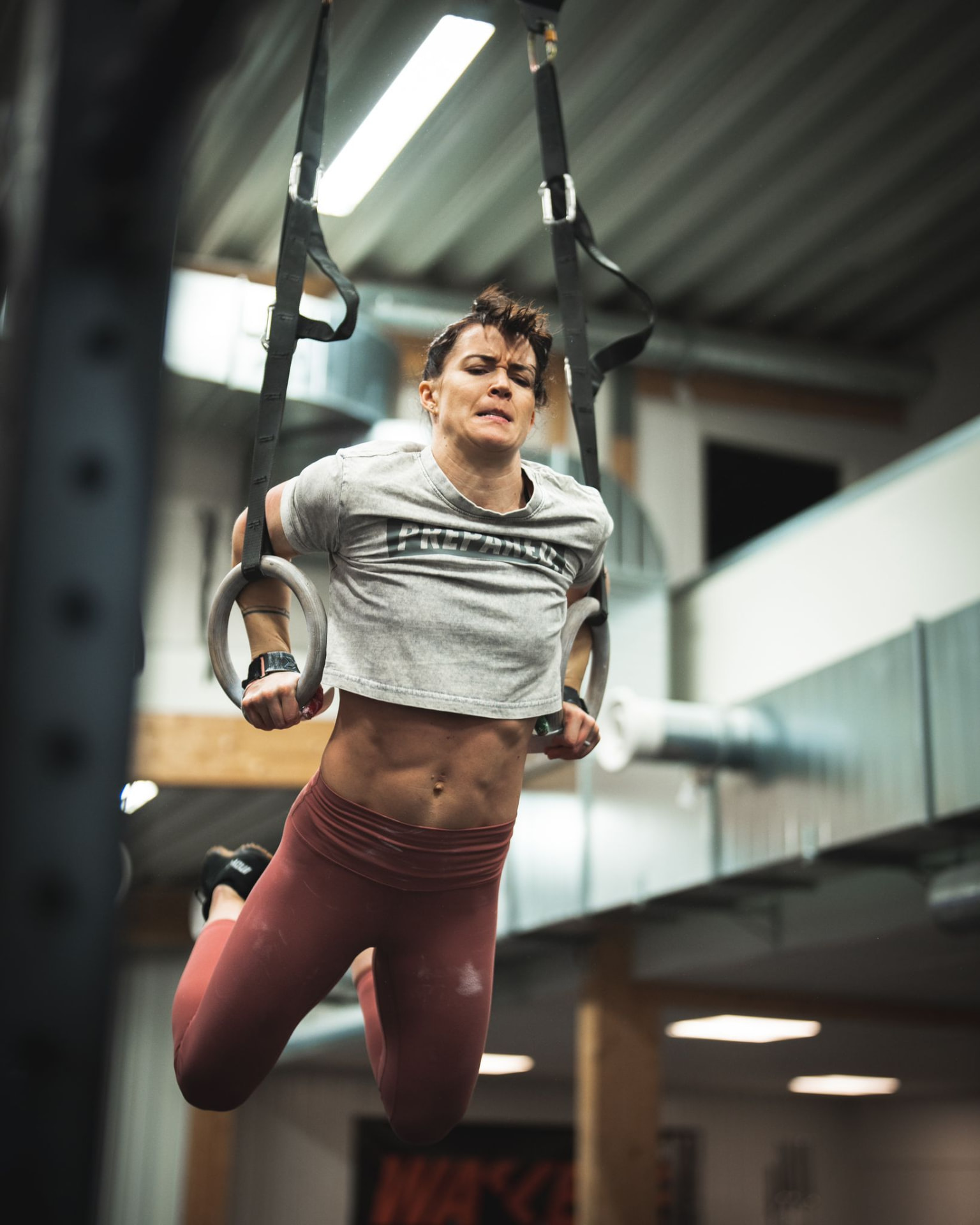 Athlete performing ring work in the gym